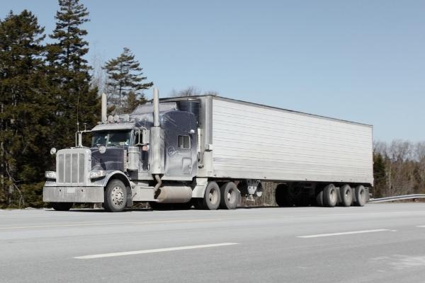 semi-truck driving down highway