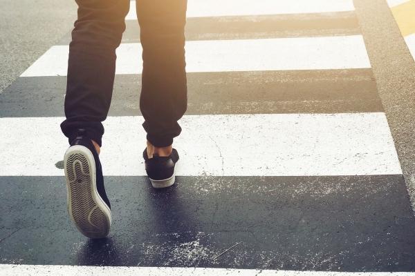 car turns to hit man walking on crosswalk