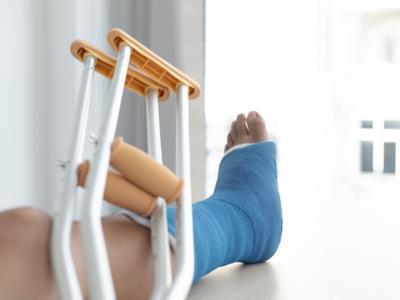 Man is in pain from broken ankle